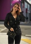Black knit cardigan embellished with sequins, featuring a belted waist and long sleeves.