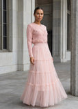Blush pink knit cardigan paired with a tiered tulle maxi skirt featuring pearl buttons by shoppegasi.
