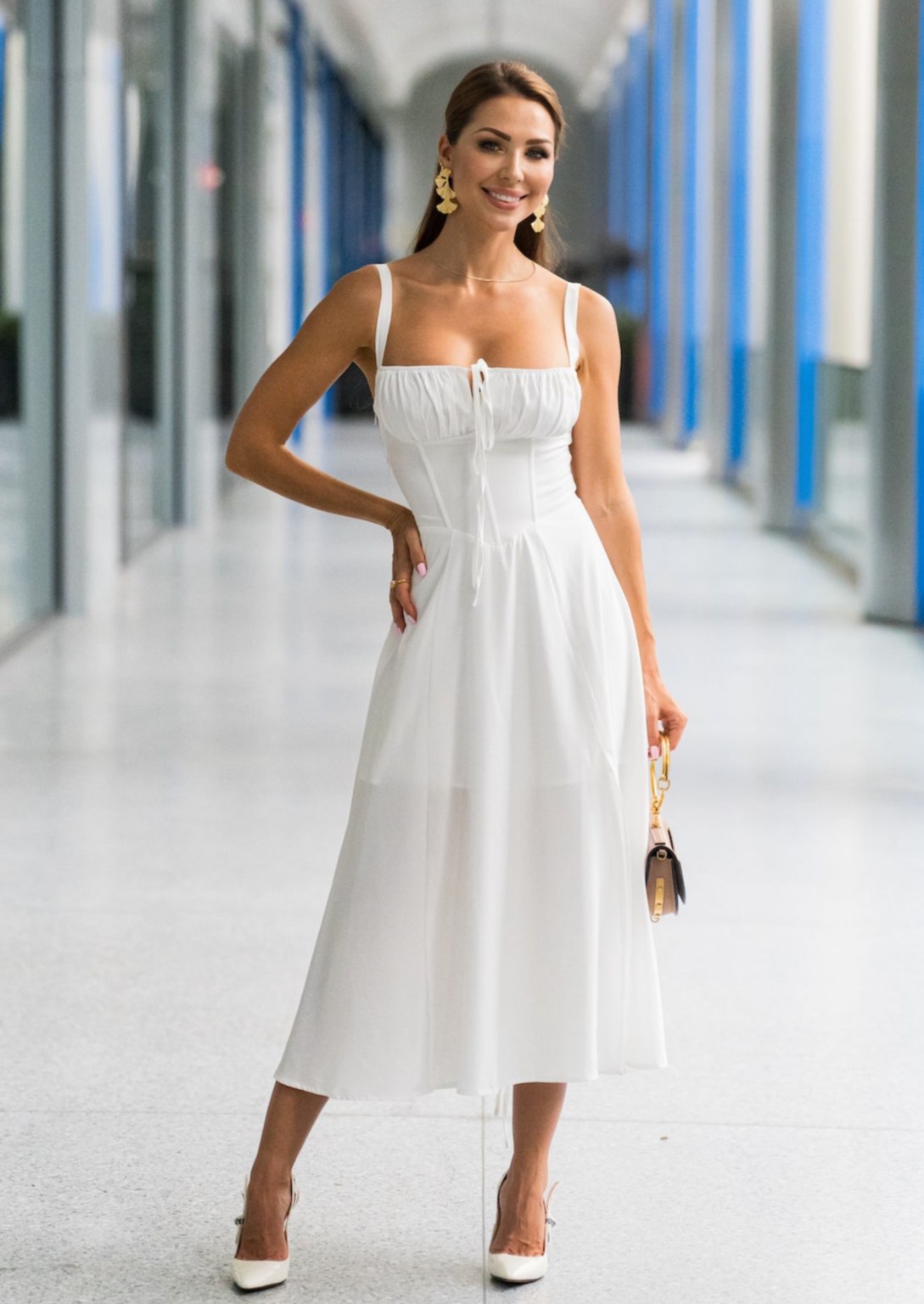 Woman in white sundress walking through flowers on a sunny Easter morning