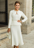 Elegant Allegra white midi dress from ShopPegasi with belted waist and peplum detail, perfect for timeless feminine style