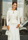 White Allegra peplum midi dress from ShopPegasi with a cinched belted waist, offering chic style for both work and events.