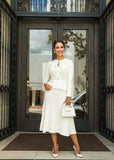 ShopPegasi Allegra white peplum midi dress with tailored silhouette, belted waist, and refined style for special occasions.