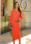 ShopPegasi Rosa coral knit set with a V-neck cardigan and gold buttons paired with a matching high-waist skirt for chic style.