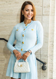 Elegant Carina pleated knit skirt co-ord with button cardigan from ShopPegasi, a ribbed knitwear two-piece outfit perfect for polished style