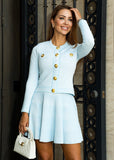 Women’s Carina pleated knit two-piece set with button-front cardigan and pleated skirt, a versatile knitwear outfit from ShopPegasi. 