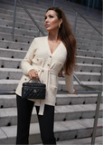 Cream textured knit belted cardigan from Shop Pegasi, cozy and stylish women's sweater