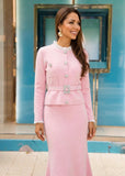 Pink knit co-ord with pearl-button embellished cardigan and matching fluted skirt.