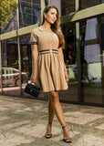 ShopPegasi Giulia buttoned pleated midi dress crafted in soft fabric with a classic fit-and-flare silhouette for timeless elegance.