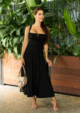 Elegant black bustier sundress styled with spring accessories for Easter brunch.