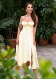 Bustier sundress in soft yellow with a flared skirt, blending comfort and style for music festivals, outdoor markets, and summer fun.