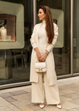 A timeless ivory knit set, including soft knit pants, a chic sleeveless top, and a relaxed-fit cardigan, perfect for elevated casual fashion.