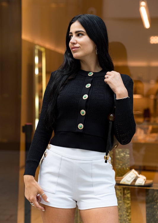 Black monogram knit cropped cardigan – a bold and stylish layering piece.