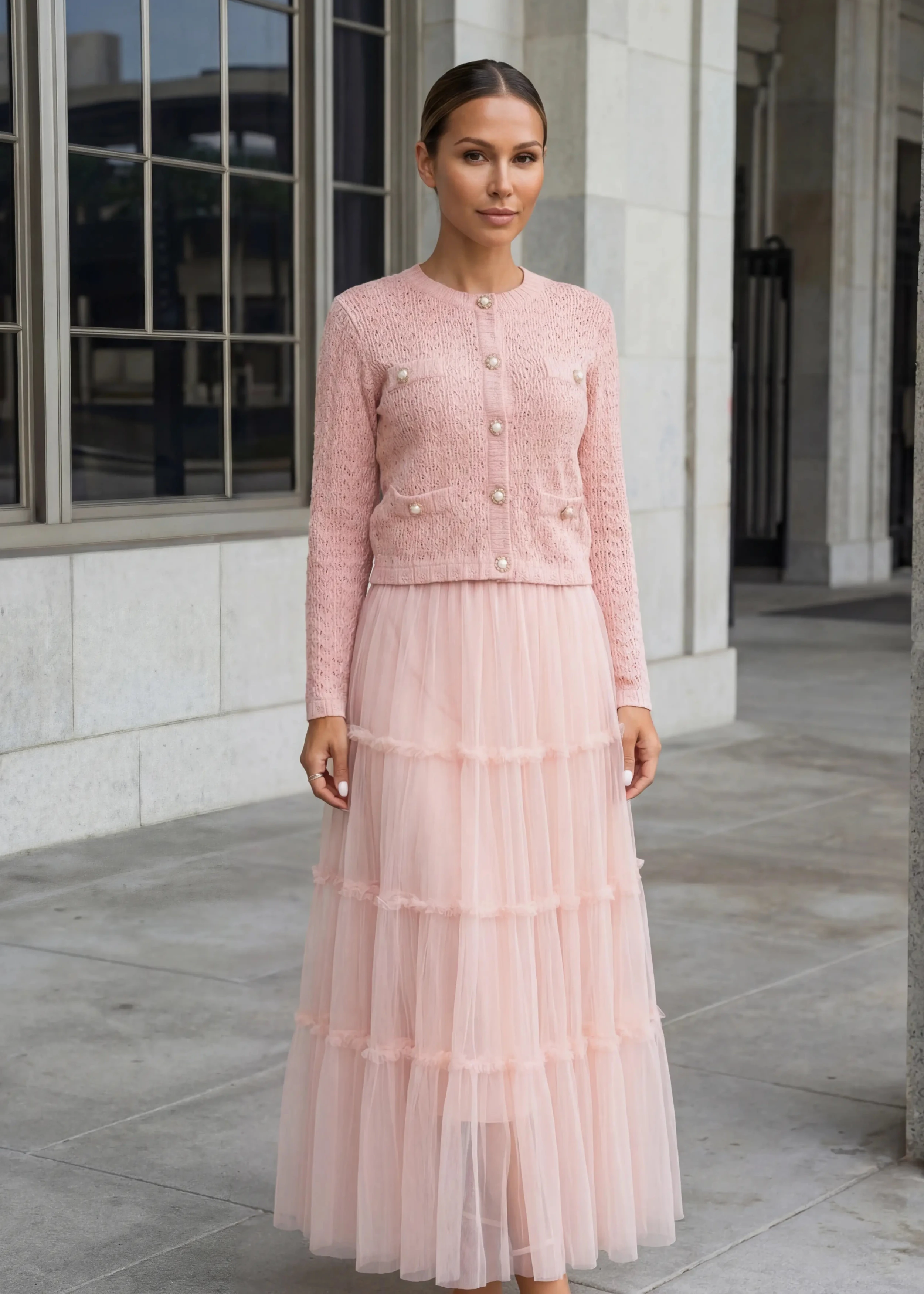 Blush pink knit cardigan with pearl buttons and matching tiered tulle maxi skirt from shoppegasi.