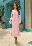 Elegant pink knit co-ord set featuring a pearl-button cardigan and fluted skirt, delivering a polished, feminine look perfect for day or evening wear.