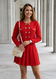 Detailed view of red knit fabric texture on the cardigan and pleated mini skirt set from shoppegasi.