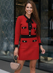 Red knit skirt and matching cardigan set with black trim from Shop Pegasi, stylish two-piece outfit