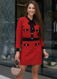 Red knit skirt and matching cardigan set with black trim from Shop Pegasi, stylish two-piece outfit