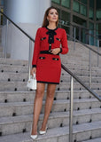Two-piece red knit set with black-trimmed cardigan and matching skirt from Shop Pegasi.