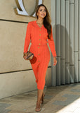 Elegant coral two-piece cable knit set from ShopPegasi, featuring a button cardigan and high-waist skirt for day-to-night wear.