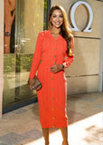 Coral knit set from ShopPegasi featuring a button-front cardigan and fitted high-waist skirt, made in soft stretch fabric.