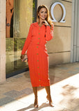 Cozy ShopPegasi knit set with a button-front cardigan and skirt in orange  cable knit, designed for layering and chic comfort. 