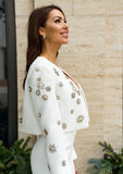 "Luxury meets style in this white blazer and pants suit with dazzling crystal touches"
