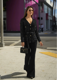 ShopPegasi black knit cardigan with sequin detailing and a waist belt