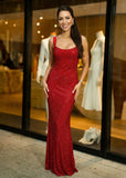 Woman wearing ShopPegasi cherry red sequin maxi dress for evening party