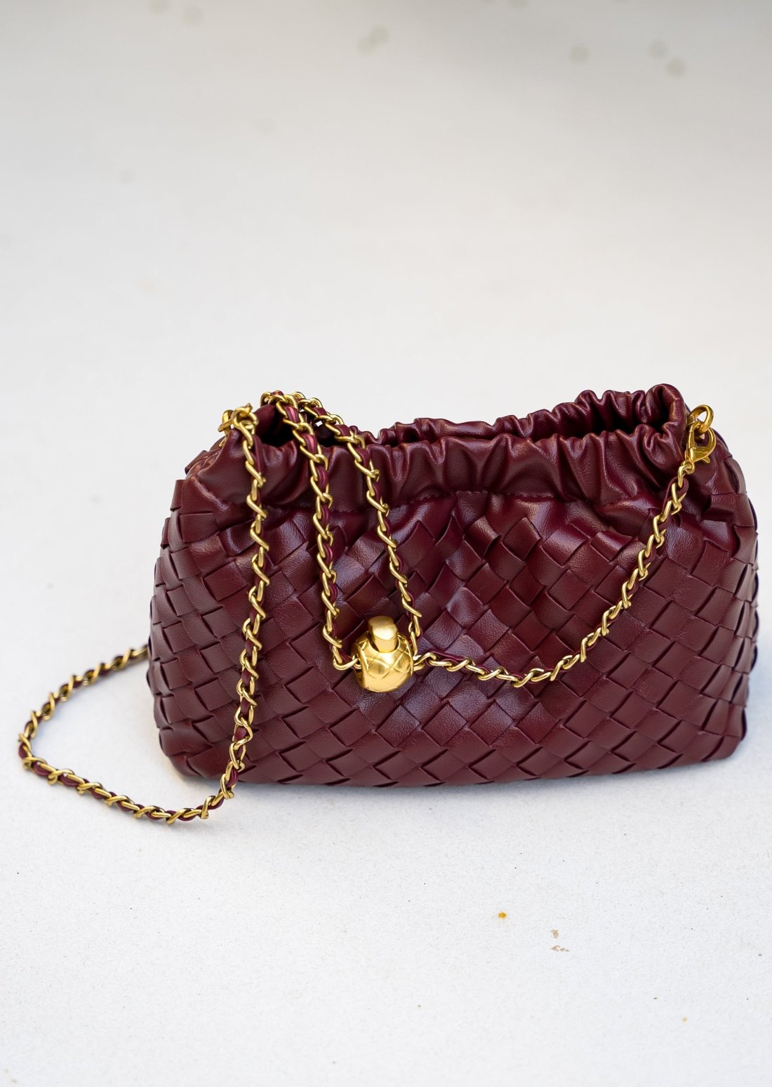 Chic and functional Cloud vegan leather handbag in burgundy with an adjustable transformable strap.