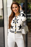 Trendy white and black star pattern knit cardigan, size L, featuring a comfortable fit and soft, textured knit fabric.