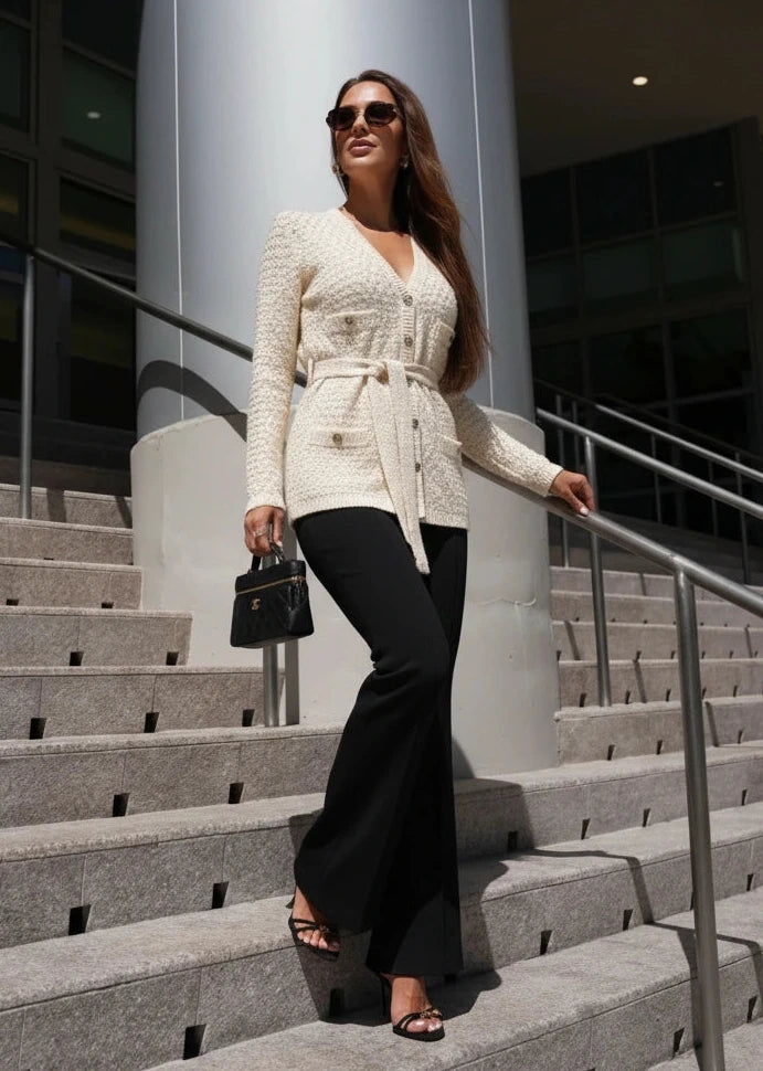 Cream knit cardigan with belt and textured pattern, chic casual knitwear from Pegasi.