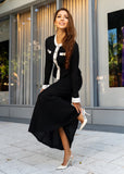 Side angle of ShopPegasi pointelle knit skirt set in black and white, chic two-piece outfit for women