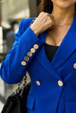 Women’s royal blue tailored blazer with gold buttons for elegant office and formal wear.