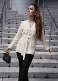 Women's cream knit cardigan with belt, textured design, comfortable and chic from Pegasi.