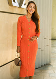 ShopPegasi Rosa coral orange co-ord set with a V-neck button cardigan and fitted knit skirt, designed for chic everyday wear.