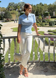"Women's fitted polo shirt in Skyline Blue with buttoned placket and short sleeves"