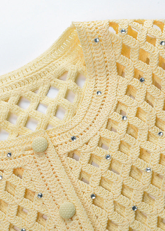 Close-up of neckline on Bianca open-knit cropped cardigan in buttery yellow with button detail and textured knit