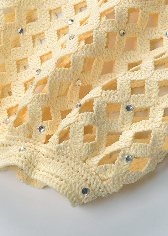 Close-up of sleeve on Bianca open-knit cropped cardigan in buttery yellow showing textured knit and airy pattern