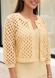 Close-up of ribbed knit texture in buttery yellow dress showing detailed fabric