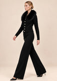 Woman walking in black knit cardigan and wide-leg pants set, side profile