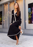 Black knit dress back view, open-weave crochet fabric with peplum seam