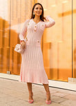 Blush pink ribbed knit midi dress with button detail front view