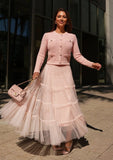 Blush tiered tulle set captured in motion highlighting flowing layered design