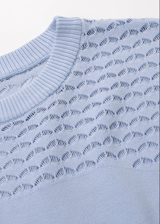 Close-up detail of powder blue pointelle knit maxi dress texture and craftsmanship