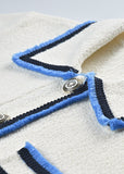cropped short sleeve knit jacket with contrast trim and front pockets detail