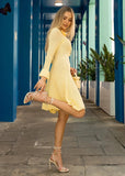 Back view of textured knit dress in buttery yellow with elegant shape