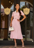 Elegant pink ribbed knit midi dress with a waist belt for a chic and flattering everyday look.
