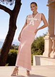 Side view of the Elodie pink pointelle knit maxi dress with a fitted silhouette