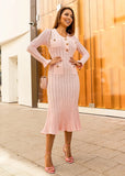 Side view of feminine blush pink midi dress with structured fit