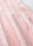 close up of blush pink knit dress neckline and soft fabric detail